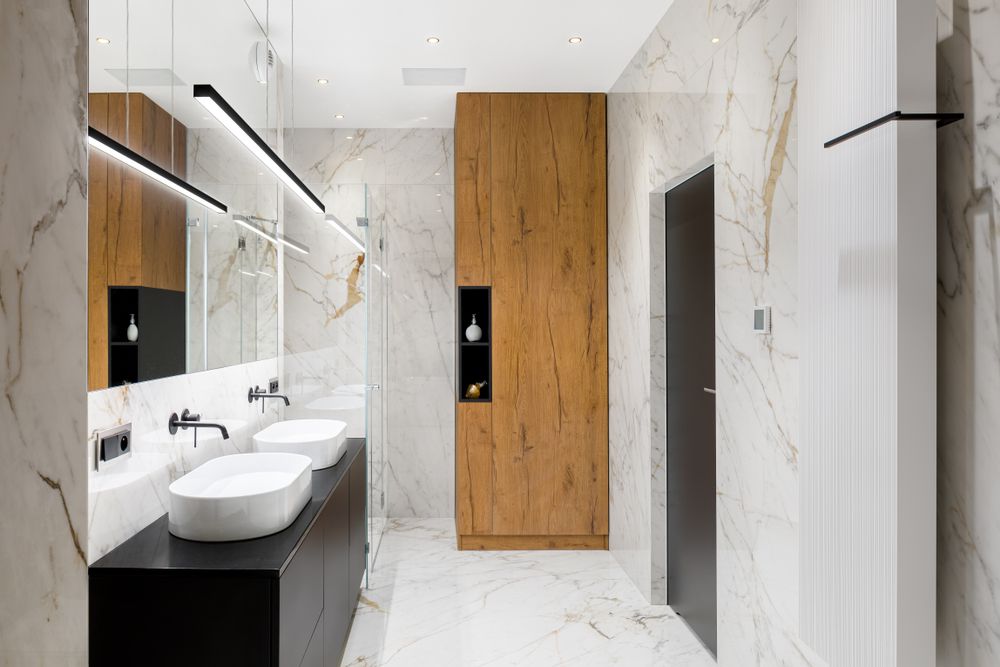 A Bathroom With Two Sinks And A Walk In Shower — Harris Design & Building Concepts In Proserpine, QLD