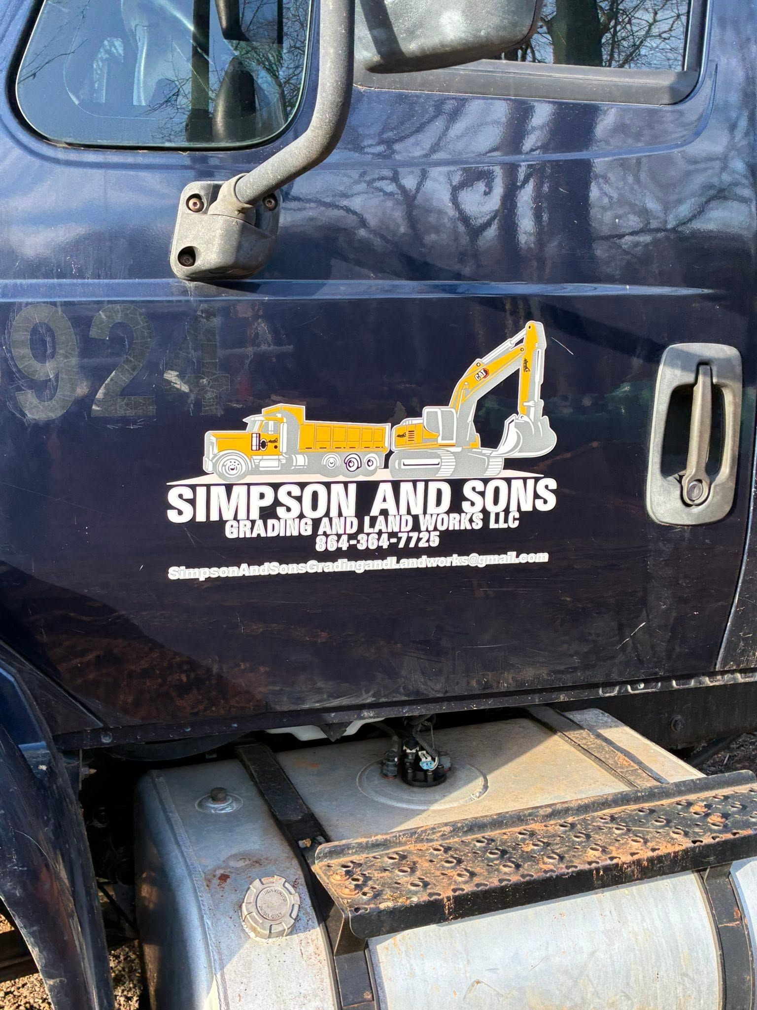 Simpson and Sons grading truck door