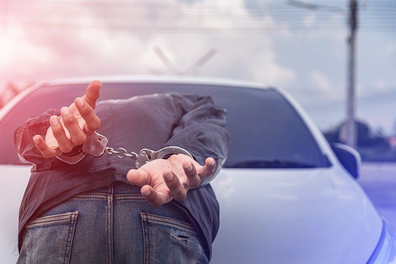 Handcuffed Criminal Lying Face Down — Fort Myers, FL — Goldberg Noone Abraham