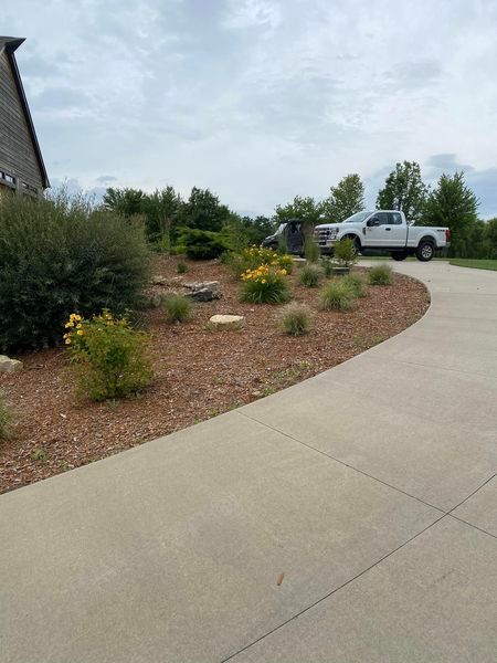 A white truck is parked in the driveway of a house.