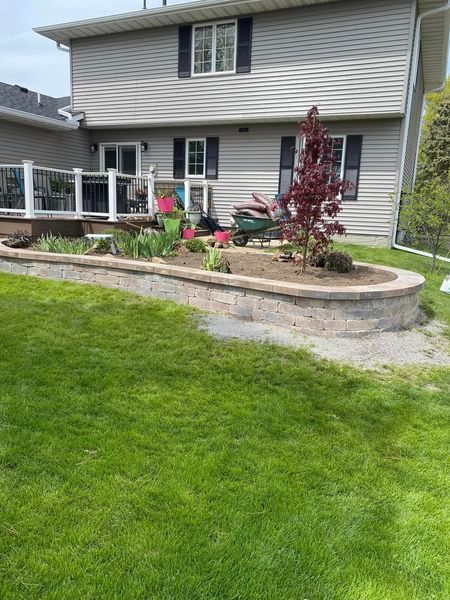 A large house with a lush green lawn in front of it.