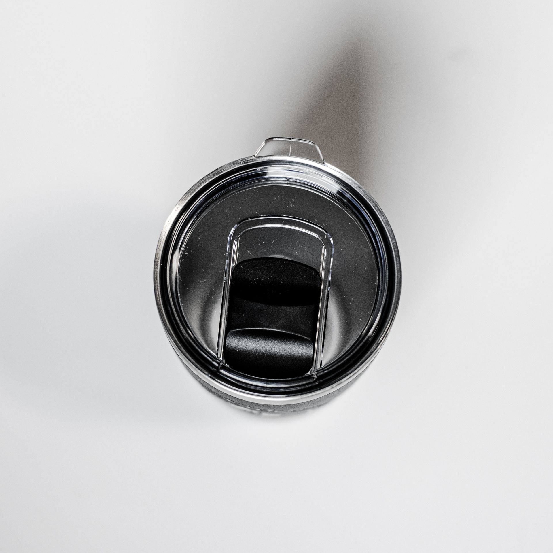 Chrome bottle opener on a white background