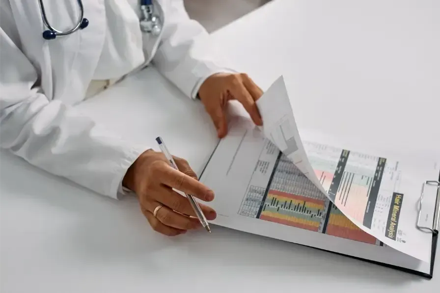 A doctor reviewing a patient chart on a clipboard, representing clinical decision-making for chronic
