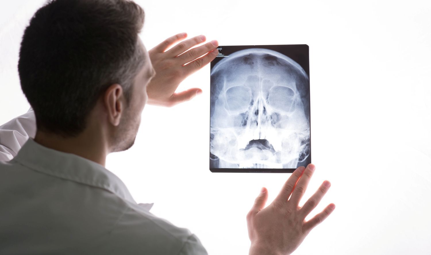 doctor examining xray and mri scans