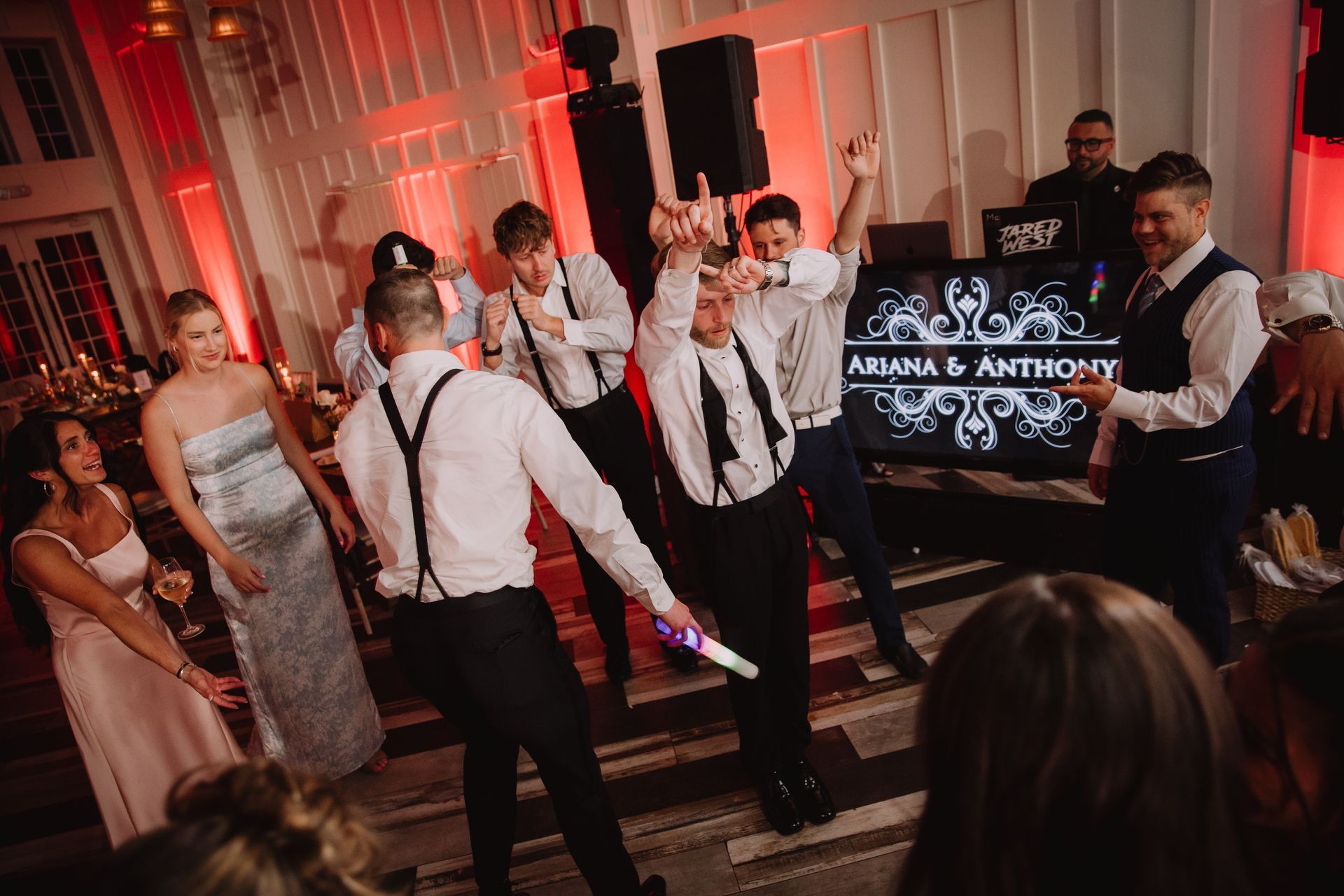 MC Jared West on the mic during Ariana and Anthony's Ryland Inn wedding reception