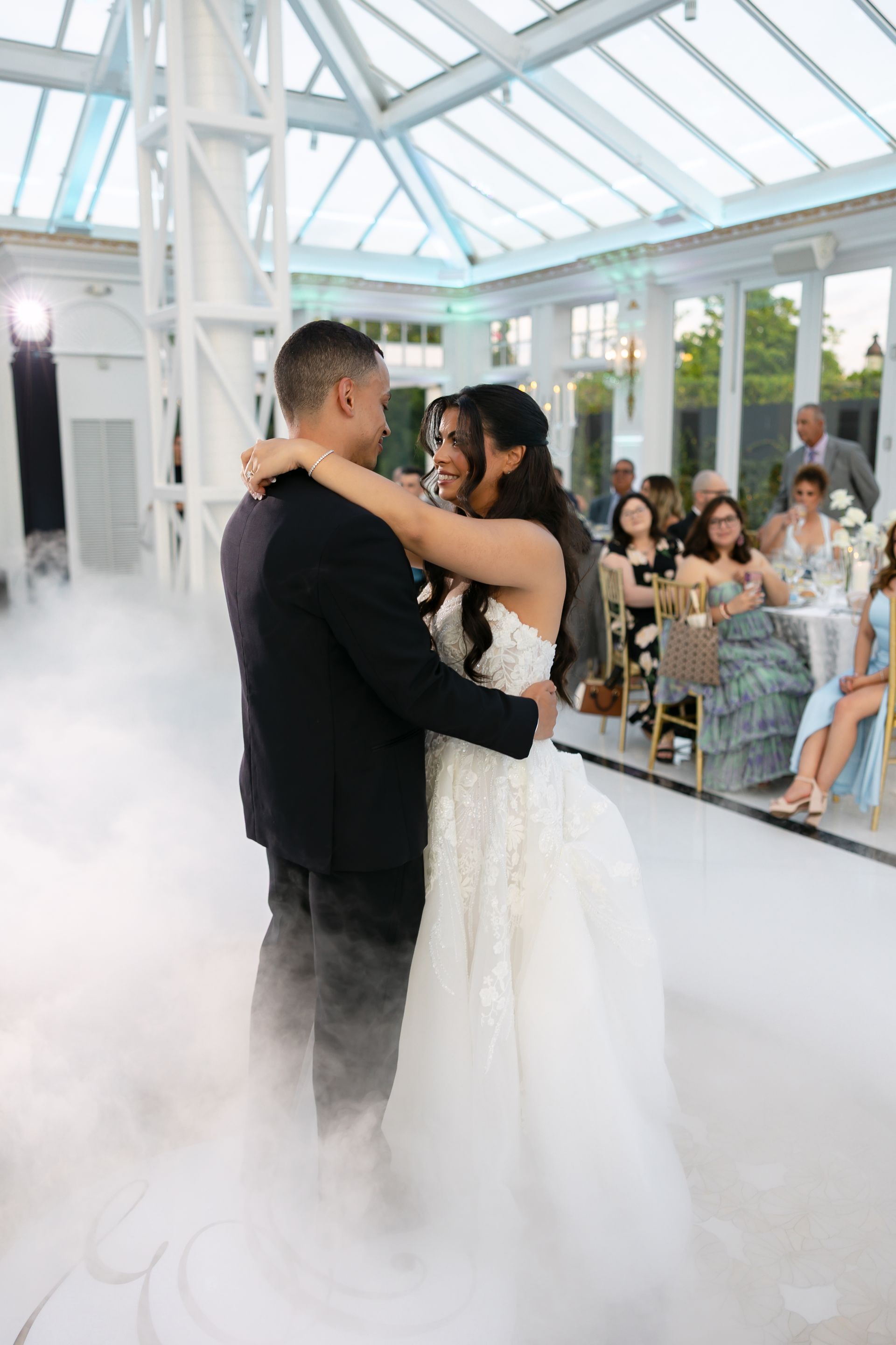 Dancing on clouds first dance under the crystal chandeliers at Eagle Oaks Glass Conservatory