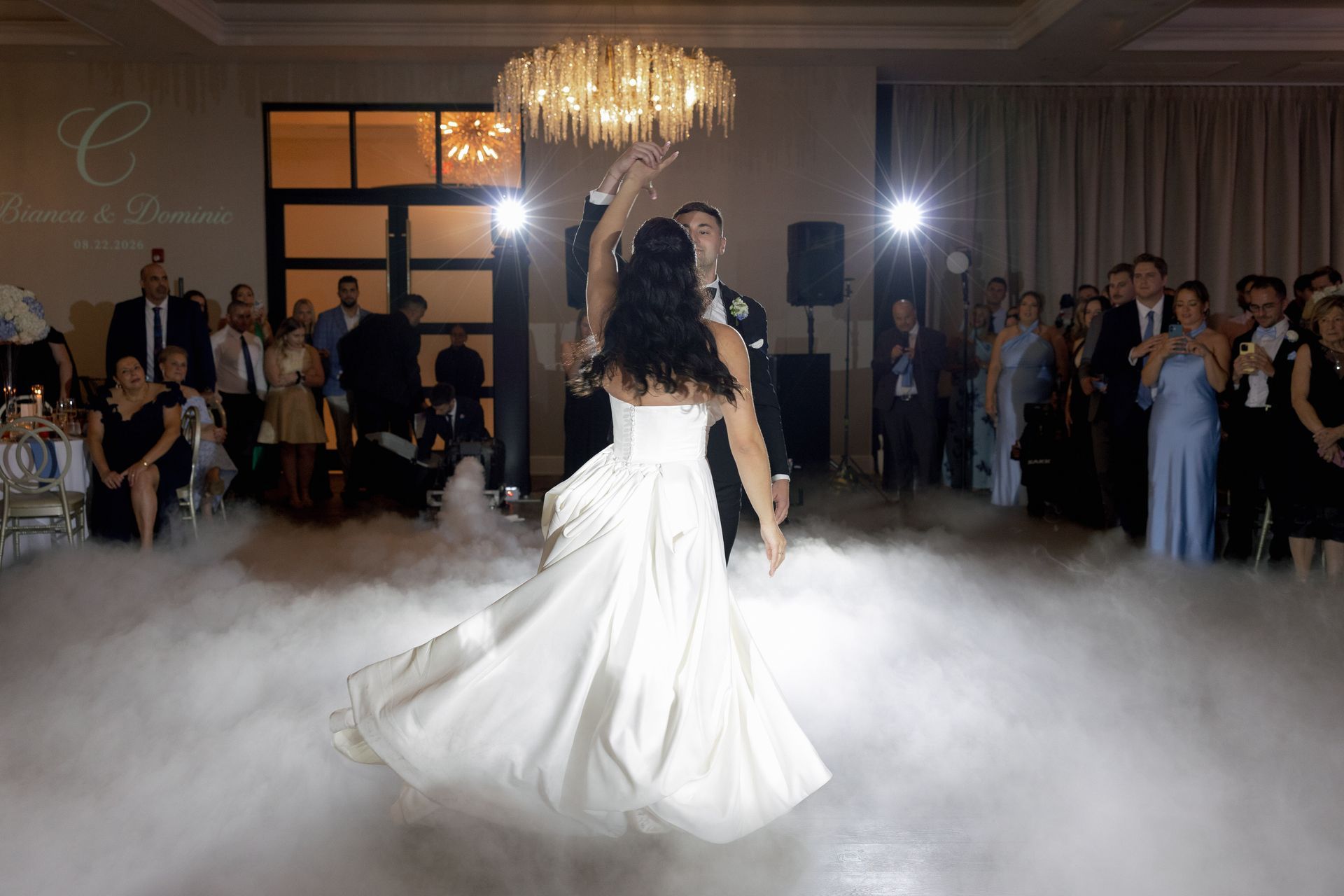 Custom monogram projection and intelligent lighting on the dance floor at Tyde at Walnut Beach
