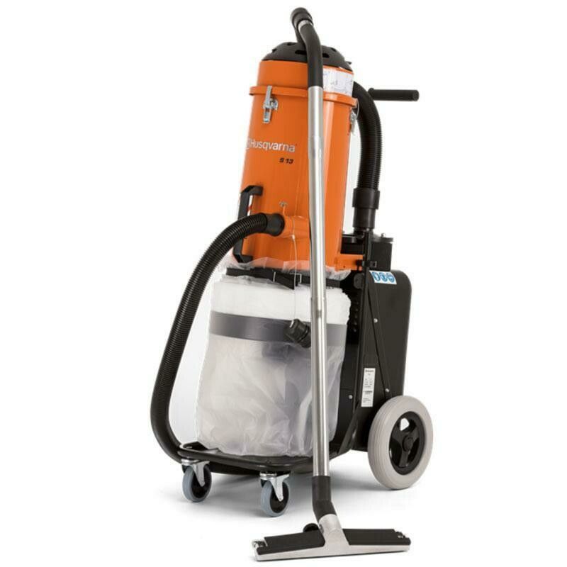 Orange commercial vacuum cleaner on a wheeled cart with a long hose and floor attachment.