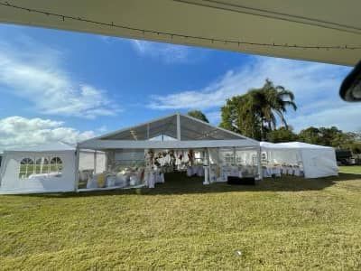 In The Center Of A Grassy Field Sits A Large White Tent – Caboolture, QLD - R & R Hire Services