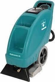 Teal carpet extractor with large wheels, handle, and cleaning head.