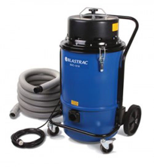 Blue Blastrac industrial vacuum cleaner with gray hose and wheels.