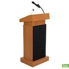 Wooden lectern with a black front panel, and a microphone attached.