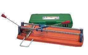 Tile cutter with red and orange base, green case.