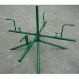 Green metal playground merry-go-round.