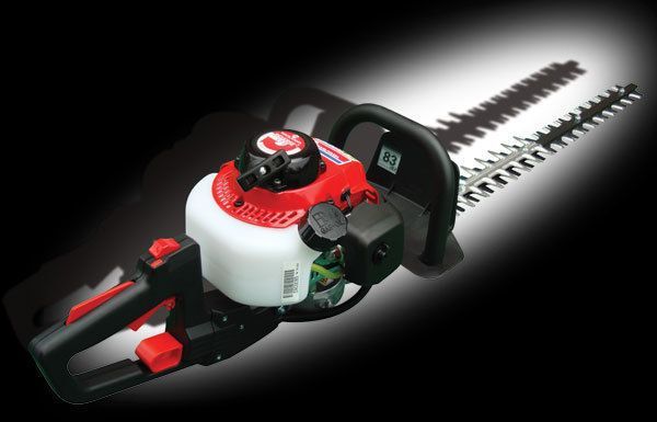 Gas-powered hedge trimmer with red and white motor, black handles, and silver blades.