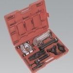 Red tool case open, containing various automotive tools.