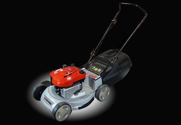 Lawnmower with red engine, black handle, gray body, and plastic wheels, on a black background.