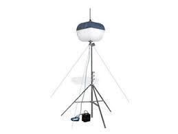 Balloon flood light on a tripod, with support cables. Black and white. Outdoors.