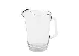 Clear glass pitcher with a handle and a pouring spout.
