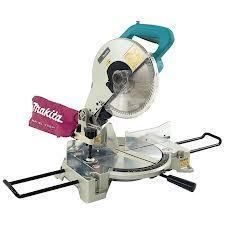 Makita miter saw, silver and teal, with a red dust bag, ready for cutting wood.