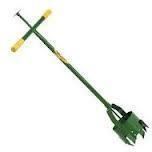 Green bulb planter tool with yellow handles, used for planting bulbs.