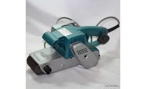 Blue and silver electric belt sander on a white surface.