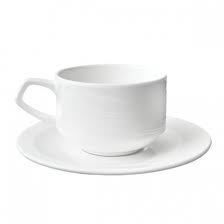 White teacup and saucer on a white background.