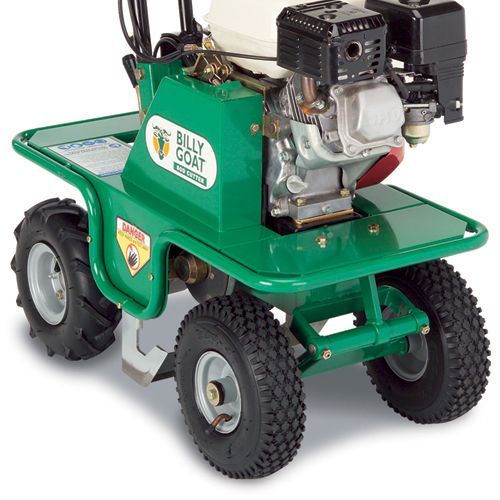 Green Billy Goat aerator with four tires and a small engine.