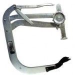 Dental caliper for measuring. Metallic with dials, arms, and a curved frame.
