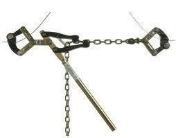 A tool with two clamps holding wires, connected by a chain, with a long lever for tensioning.