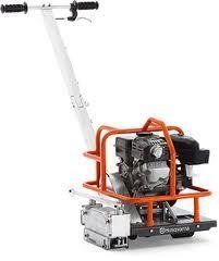 Orange and white Husqvarna concrete grinder with a black engine and handles.