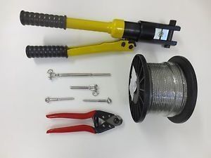 Tools for wire rope: crimper, cutters, hardware, and a spool of wire.