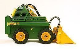 Green and yellow Kangoo skid steer loader with a raised bucket.