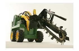 Green and yellow trencher machine on a white surface.