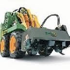 Green and yellow skid steer with brush cutter attachment.