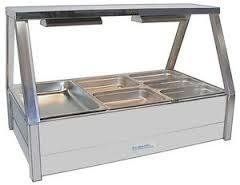 A stainless steel food warmer with rectangular containers and overhead lights.