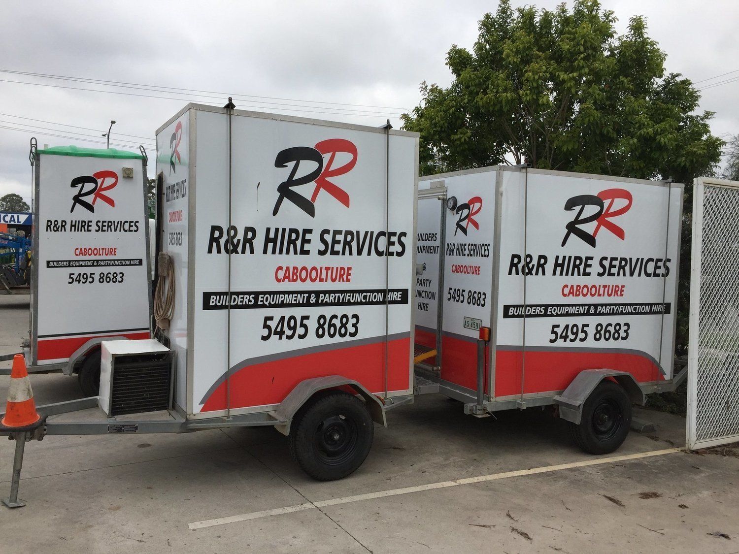 Three white trailers with 