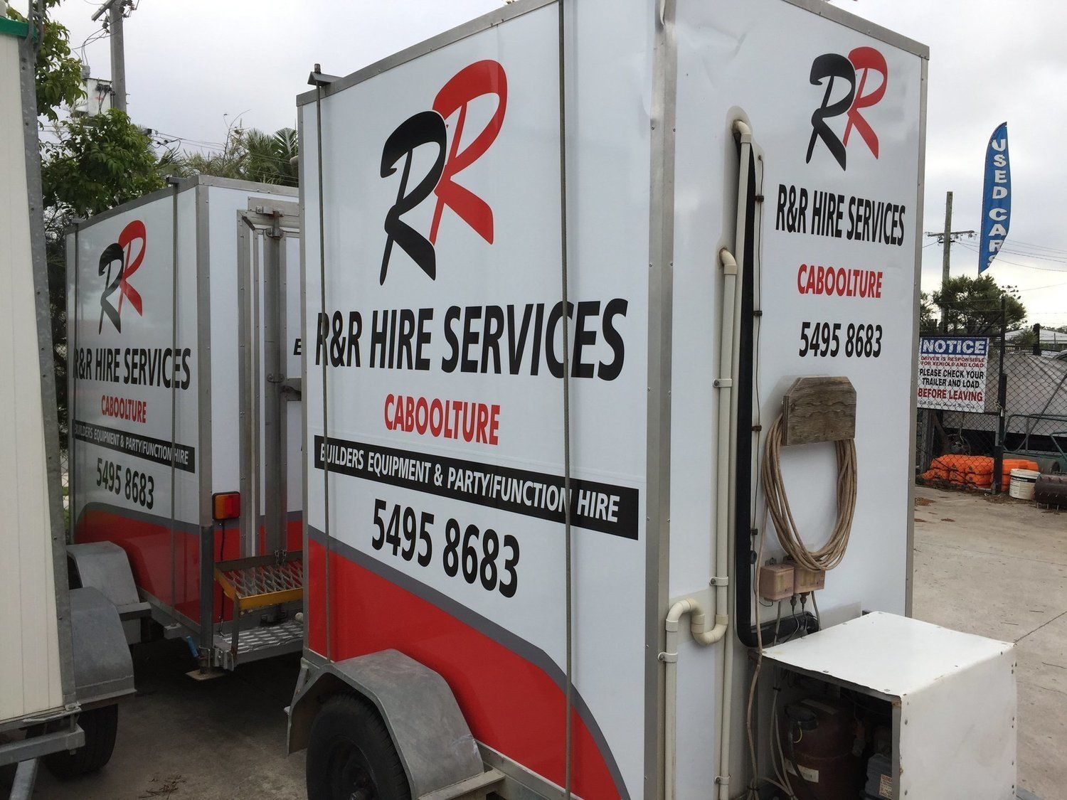 Two white trailers with 