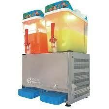 Two-tank slushy machine with orange and yellow drinks, stainless steel base, blue drip trays.