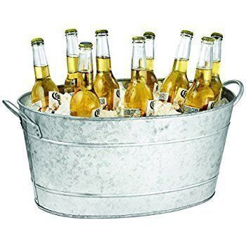 Oval galvanized metal tub filled with ice and beer bottles.