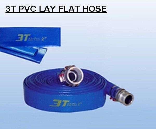 Blue PVC lay flat hose, rolled up with metal connectors, on a light blue gradient background.