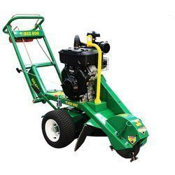Green and black stump grinder on wheels; outdoors.