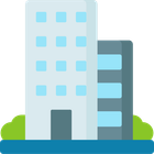 It is a flat icon of a building with a lot of windows.