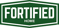 Green and white Fortified Home logo in a shield shape