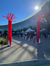 Three columns of balloons with volleyballs on top of them