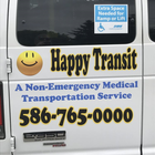 Happy Transit medical transportation van with wheelchair ramp sticker and phone number 586-765-0000