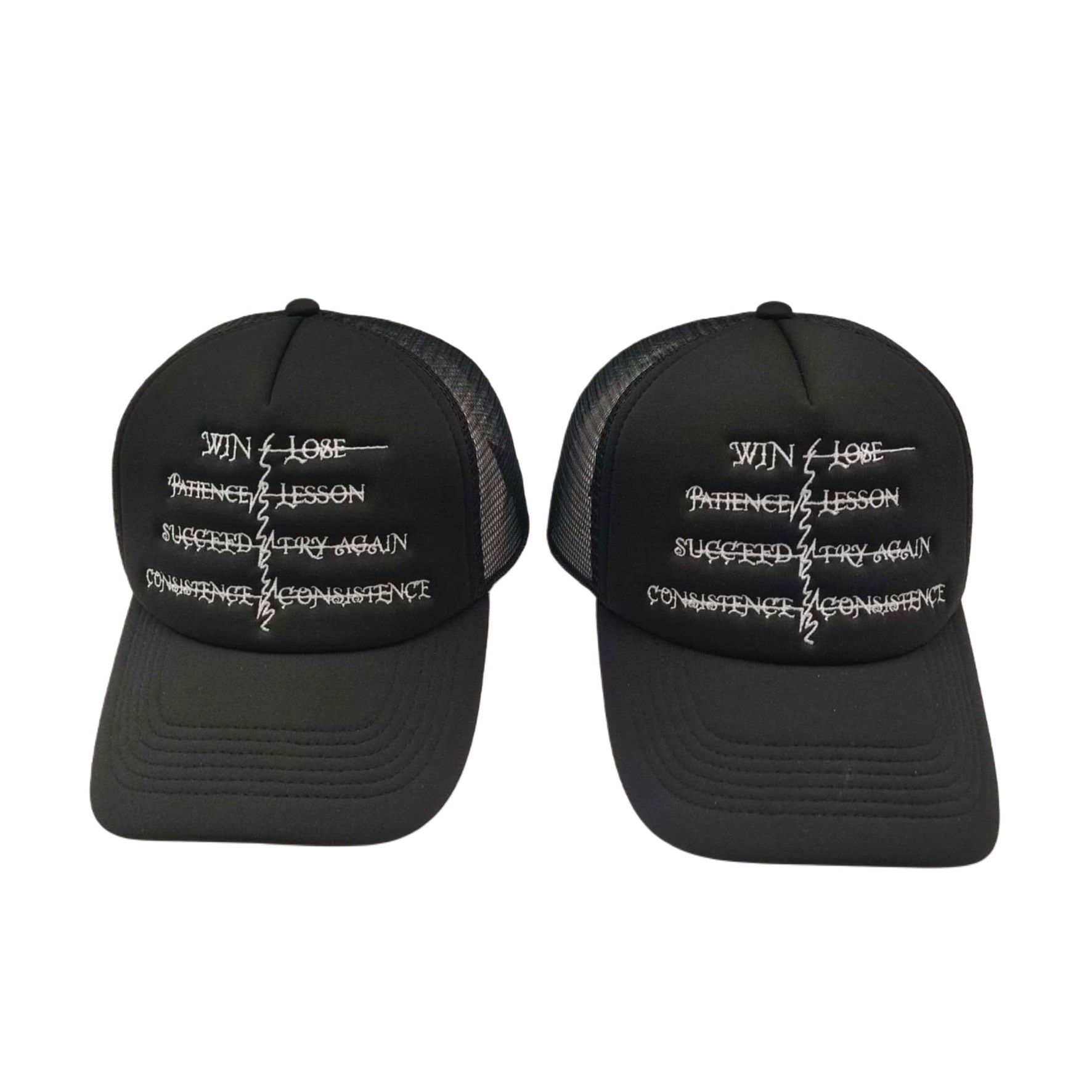 Two black trucker hats with white embroidered text: