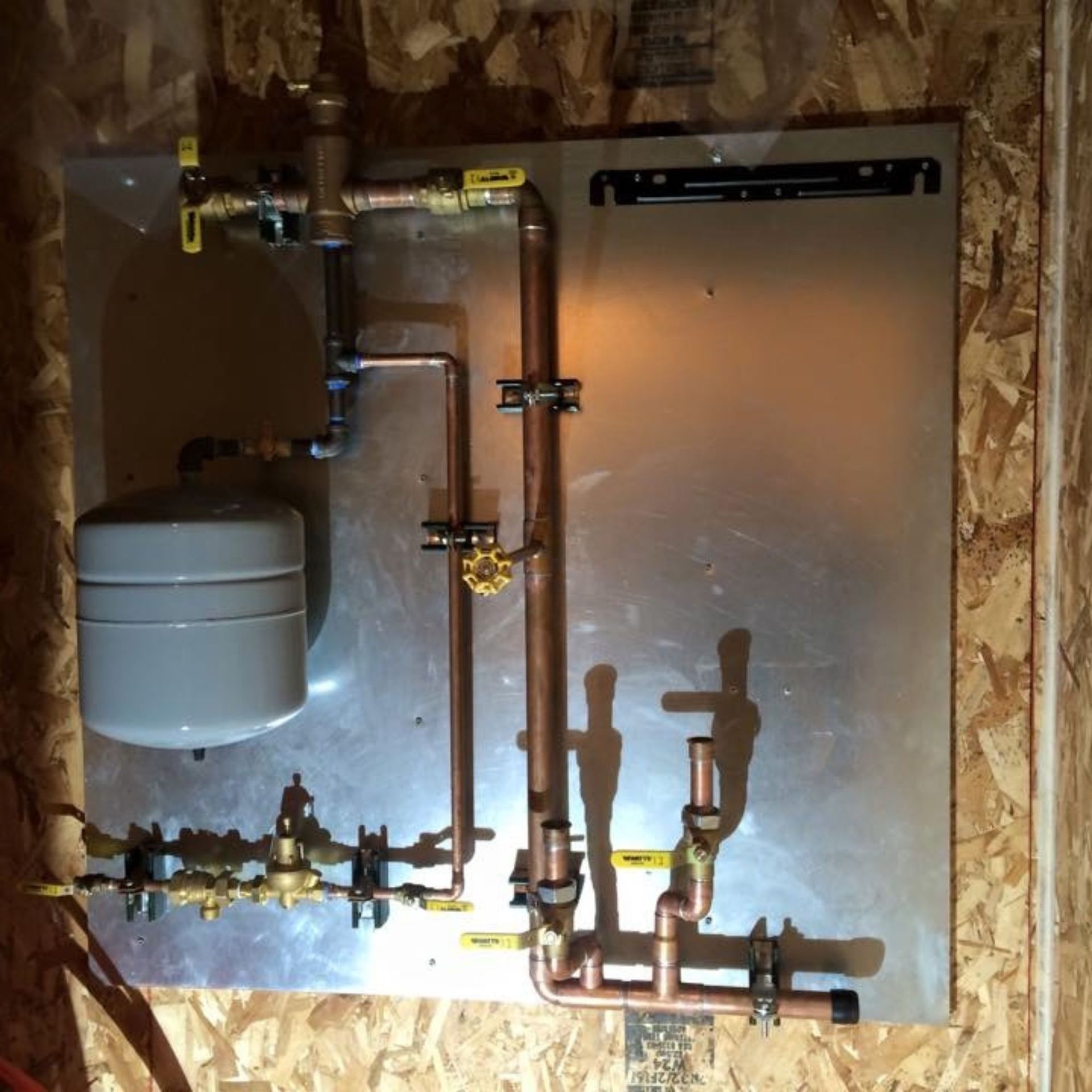 Lake Area Heating and Cooling LLC | Copper pipes are connected to a stainless steel panel