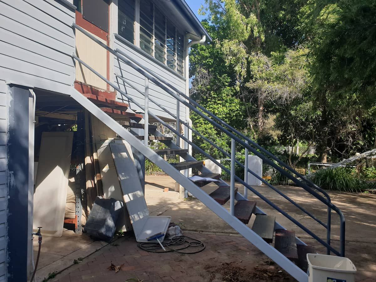 A Set of Stairs Leading Up to a House — Gaspen Builders & Carpenters in Kirwan, QLD