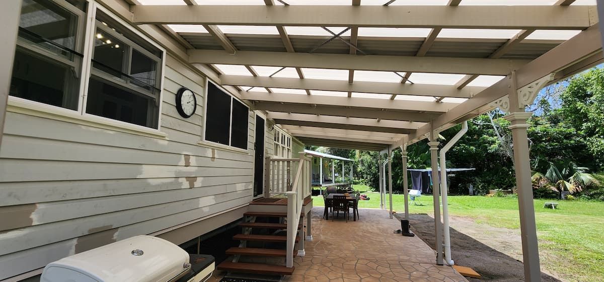A White House With a Covered Porch and Stairs — Gaspen Builders & Carpenters in Kirwan, QLD